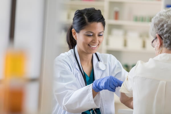 A woman giving a flu shot